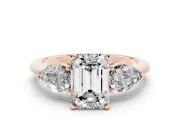 Three-Stone Emerald Cut Diamond Ring Set in Rose gold with Pear Side Stones and Prong Setting