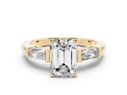 Emerald Cut Diamond Solitaire Ring Set in Yellow gold with Tapered Baguette Side Stones and Prong Setting