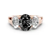 Fancy Black Three-Stone Oval Cut Diamond Ring Set in Rose gold with Matching Prong Settings and Plain Band