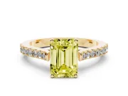 Fancy Yellow Emerald Cut Diamond Solitaire Engagement Ring Set in Yellow gold with Delicate Pavé Band and Prong Setting