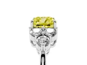 Fancy Yellow Cushion Cut Diamond Solitaire Ring Set in White gold with Cluster Accents on Each Side