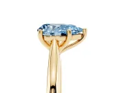 Fancy Blue Pear Cut Diamond Solitaire Ring Set in Yellow gold with Cathedral Band and Prong Setting