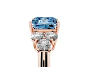 Fancy Blue Princess Cut Diamond Cluster Ring Set in Rose gold with Round Accent Stones and Prong Setting on a Plain Band