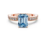 Fancy Blue Emerald Cut Diamond Solitaire Ring Set in Rose gold with Slim Pavé Band and Prong Setting