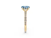 Fancy Blue Oval Cut Diamond Pavé Band Ring Set in Yellow gold with Prong-Set Center Stone