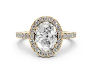 Oval Cut Diamond Halo Pavé Solitaire Ring Set in Yellow gold with Prong-Set Center Stone