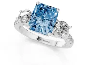 Fancy Blue Three-Stone Radiant Cut Diamond Pavé Band Ring Set in White gold with Prong-Set Trio