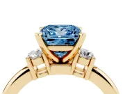 Fancy Blue Three-Stone Princess Cut Diamond Ring Set in Yellow gold with Prong Setting and Plain Band