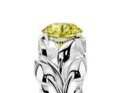 Fancy Yellow Round Cut Diamond Leaf-Inspired Engagement Ring Set in White gold with Round Accents