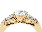 Oval Cut Diamond Cluster Ring Set in Yellow gold with Round Accent Stones and Prong Setting on a Plain Band