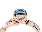 Fancy Blue Emerald Cut Diamond Solitaire Ring Set in Rose gold with Twisted Marquise Accent Band