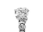 Heart Cut Diamond Three-Stone Ring Set in Platinum with Pavé Band