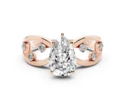 Pear Cut Diamond Solitaire Ring Set in Rose gold with Side Stones on Criss-Cross Band and Prong Setting