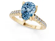 Fancy Blue Pear Cut Diamond Solitaire Ring Set in Yellow gold with Brilliant Pavé Band and Prong Setting