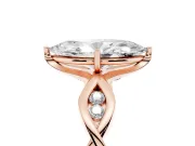 Marquise Cut Diamond Twist Band Solitaire Ring Set in Rose gold with Leaf Prong Setting and Accent Stones
