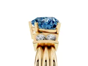 Fancy Blue Three-Stone Heart Cut Diamond Channel Set Ring Set in Yellow gold with Bar Prongs