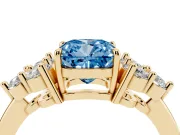 Fancy Blue Cushion Cut Diamond Solitaire Ring Set in Yellow gold with Cluster Accents on Each Side