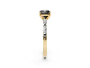 Fancy Black Cushion Cut Diamond Solitaire Set in Yellow gold with Side Baguettes and Channel Set Band