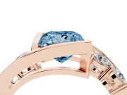 Fancy Blue Princess Cut Diamond Bezel Bypass Ring Set in Rose gold with Round Accents