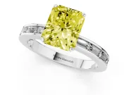 Fancy Yellow Radiant Cut Diamond Solitaire Ring Set in White gold with Channel-Set Baguette Band and Prong Setting