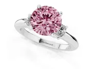 Fancy Pink Three-Stone Round Cut Diamond Ring Set in White gold with Prong Setting and Plain Band