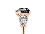 Fancy Black Three-Stone Heart Cut Diamond Ring Set in Rose gold with Pear Side Stones and Prong Setting