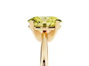 Fancy Yellow Oval Cut Diamond Solitaire Ring Set in Yellow gold with Prong Setting on a Plain Round Band