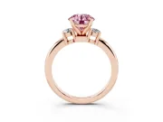 Fancy Pink Three-Stone Round Cut Diamond Ring Set in Rose gold with Prong Setting and Plain Band