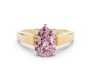 Fancy Pink Pear Cut Diamond Solitaire Engagement Ring Set in Yellow gold with Prong Setting and Tapered Band
