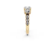 Cushion Cut Diamond Three-Stone Ring Set in Yellow gold with Pavé Band