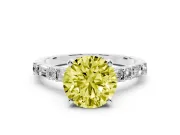 Fancy Yellow Round Cut Diamond Solitaire Set in Platinum with Side Baguettes and Channel Set Band