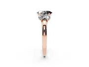 Fancy Black Oval Cut Diamond Three-Stone Ring Set in Rose gold with Bold Center and Classic Band