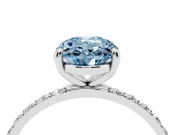 Fancy Blue Oval Cut Diamond Solitaire Ring Set in Silver with Round Pavé Band and Prong Setting