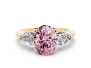 Fancy Pink Three-Stone Oval Cut Diamond Ring Set in Yellow gold with Pear Side Stones and Prong Setting