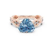 Fancy Blue Heart Cut Diamond Twist Band Solitaire Ring Set in Rose gold with Leaf Prong Setting and Accent Stones