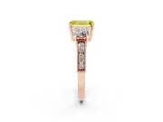 Fancy Yellow Emerald Cut Diamond Three-Stone Ring Set in Rose gold with Round Side Stones and Pavé Band