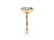 Fancy Blue Marquise Cut Diamond Solitaire Ring Set in Yellow gold with Twisted Band and Bead Prong Setting
