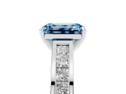 Fancy Blue Emerald Cut Diamond Solitaire Ring Set in White gold with Channel-Set Band and Prong Setting