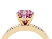 Fancy Pink Cushion Cut Diamond Solitaire Ring Set in Yellow gold with Channel-Set Baguette Band and Prong Setting