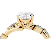 Oval Cut Diamond Solitaire Ring Set in Yellow gold with Twisted Marquise Accent Band
