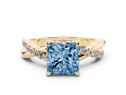 Fancy Blue Princess Cut Diamond Twist Band Solitaire Set in Yellow gold with Pavé Accents and Prong Setting