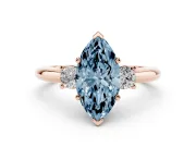 Fancy Blue Three-Stone Marquise Cut Diamond Ring Set in Rose gold with Prong Setting and Plain Band