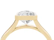 Bezel Set Radiant Cut Diamond Solitaire Ring Set in Yellow gold with Tapered Band