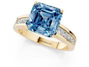 Fancy Blue Asscher Cut Diamond Solitaire Ring Set in Yellow gold with Channel-Set Band and Prong Setting