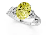 Fancy Yellow Oval Cut Diamond Solitaire Leaf-Inspired Ring Set in White gold with Pavé Band and Prong Setting