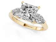 Three-Stone Princess Cut Diamond Ring Set in Yellow gold with Pear Side Stones and Prong Setting