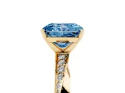 Fancy Blue Radiant Cut Diamond Engagement Ring Set in Yellow gold with Side Stone Accents and Prong Setting