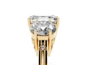 Emerald Cut Diamond Three-Stone Engagement Ring Set in Yellow gold with Polished Band
