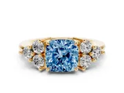 Fancy Blue Cushion Cut Diamond Solitaire Ring Set in Yellow gold with Cluster Accents on Each Side