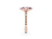 Fancy Pink Marquise Cut Diamond Solitaire Engagement Ring Set in Rose gold with Bezel Accents on Beaded Band